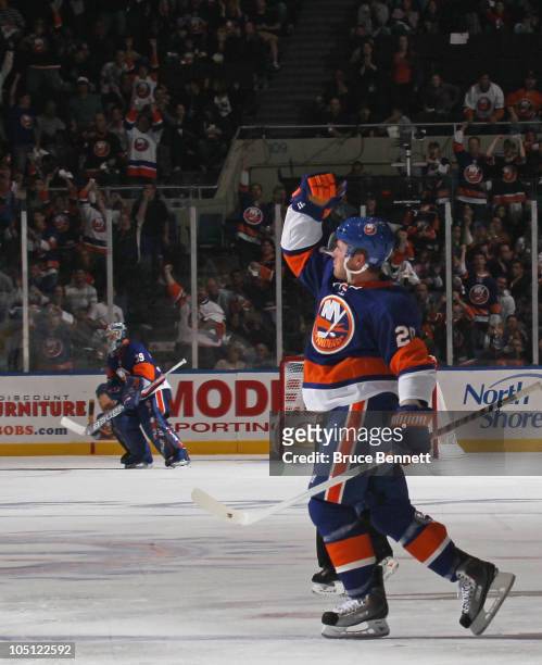 James Wisniewski of the New York Islanders scores a power play goal at 6:21 of the seocnd period against the Dallas Stars at the Nassau Coliseum on...