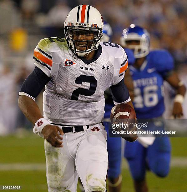 Auburn quarterback Cam Newton ran for a first down in the second quarter against Kentucky at Commonwealth Stadium on Saturday, October 9, 2010 in...