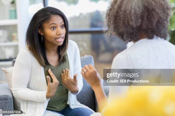 teenage girl argues with mother at home - teenagers arguing stock pictures, royalty-free photos & images