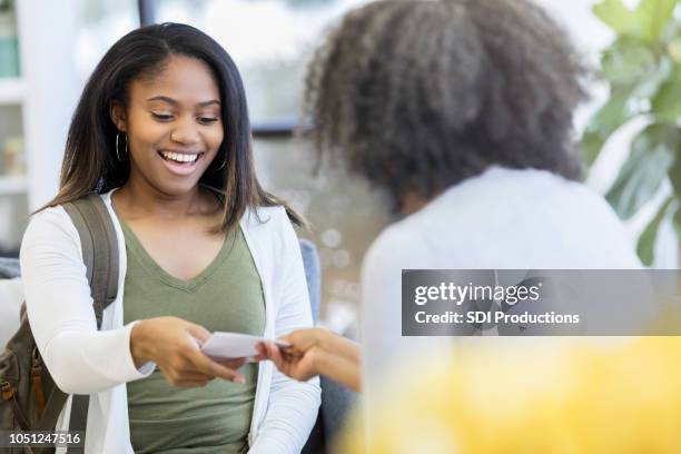 teenage girl receives a letter containing good news - doctor giving good news stock pictures, royalty-free photos & images