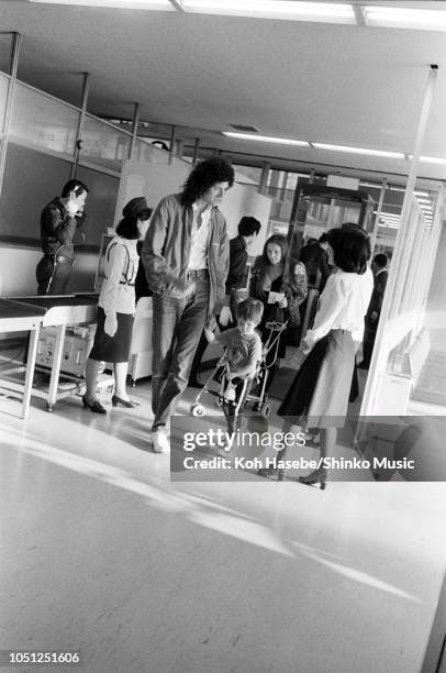 Brian May of Queen with his wife Christine Mullen and family at Fukuoka Airport, on the Hot Space Japan tour, Fukuoka, Japan, 19 October 1982.