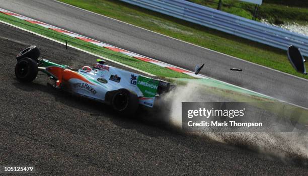 Vitantonio Liuzzi of Italy and Force India crashes at the first corner at the start of the Japanese Formula One Grand Prix at Suzuka Circuit on...