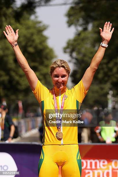 Rochelle Gilmore of Australia poses with the gold medal during the medal ceremony for the Women's Road Race on the street's of Delhi during day seven...