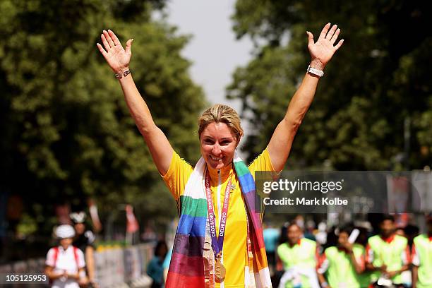 Rochelle Gilmore of Australia poses with the gold medal during the medal ceremony for the Women's Road Race on the street's of Delhi during day seven...
