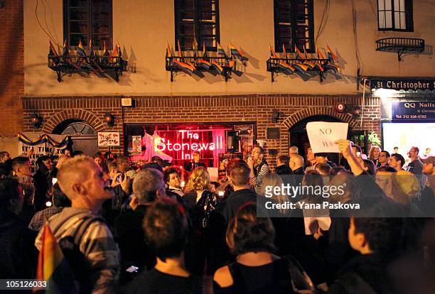 People participate in Queer Rising's "Take Back the Night" gay rights march in front of The Stonewall Inn October 9, 2010 in New York City. Queer...