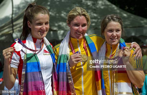 To R England's Elizabeth Armistead, Australia's Rochelle Gilmore and Australia's Chloe Hosking show their medals during the Women's 112km Road Race...