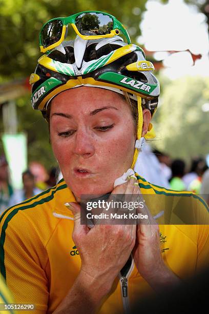 Rochelle Gilmore of Australia wipes her face after finishing the Women's Road Race in first place and wins the gold medal during day seven of the...