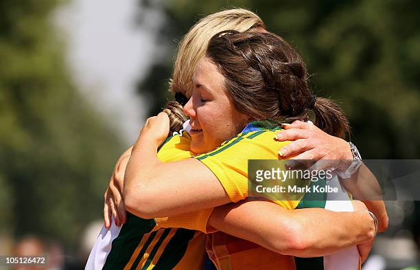 Rochelle Gilmore of Australia and Chloe Hosking of Australia congratulate each other during the medal ceremony for the Women's Road Race on the...