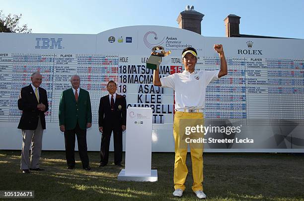 Hideki Matsuyama of Japan stands with the trophy after winning the 2010 Asian Amateur Championship at Kasumigaseki Country Club on October 10, 2010...