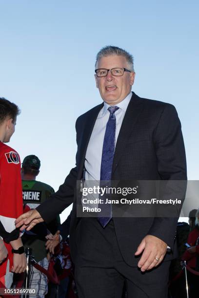 Marc Crawford, Ottawa Senators Associate coach, walks the red carpet prior to the start of their home opener against the Chicago Blackhawks at...