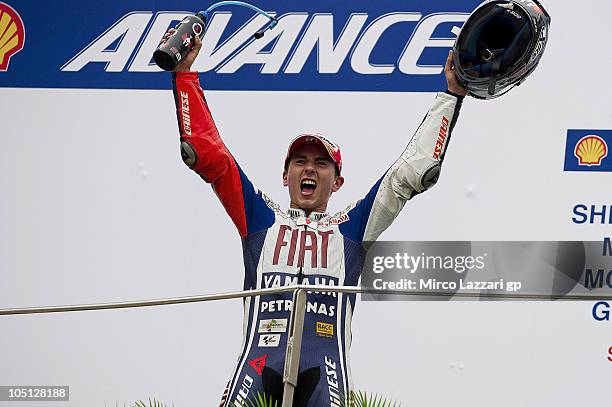 Jorge Lorenzo of Spain and Fiat Yamaha celebrates third place and overall victory in this year's MotoGP World Championship at the end of the MotoGP...