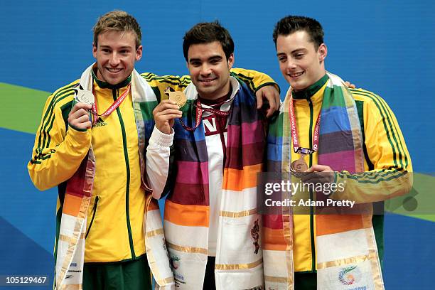 Matthew Mitcham of Australia, Alexandre Despatie of Canada and Scott Robertson of Australia pose with the medals won in the Men's 1m Springboard...