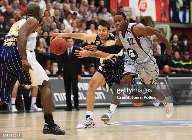 Bryan Bailey of Quakenbrueck and Oliver Stevic of Oldenburg battle for the ball during the Basketball Bundesliga match between Artland Dragons and...