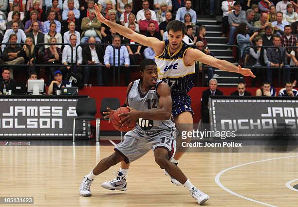 Byan Bailey of Quakenbrueck and Oliver Stevic of Oldenburg battle for the ball during the Basketball Bundesliga match between Artland Dragons and EWE...