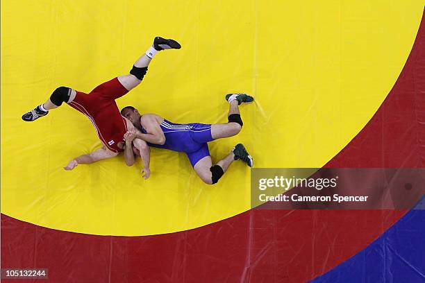 Denis Roberts of Australia competes against Mark Crocker of England in the men's 120kg freestyle final 3-5 wrestling at IG Sports Complex during day...