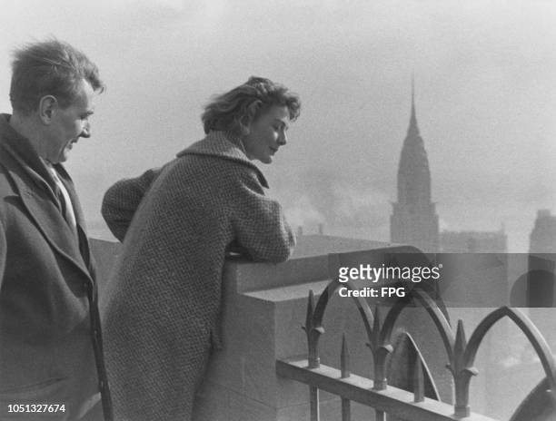 English actors Michael Redgrave and his daughter Vanessa looking at the view of Manhattan from the 'Top of the Rock' observation deck at 30...