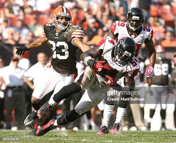 Linebacker Stephen Nicholas of the Atlanta Falcons intercepts the ball in front of wide receiver Chansi Stuckey of the Cleveland Browns at Cleveland...