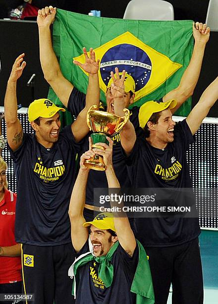 Brazil's capitain Gilberto Godoy Filhoon holds aloft the trophy after their men's Volleyball World Championships final in Rome's Palalottomatica on...