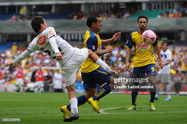 America's player Daniel Montenegro vies for the ball with Sergio Perez of Monterrey during their match as part of the Apertura 2010 at the Azteca...