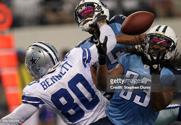 Safety Michael Griffin of the Tennessee Titans makes an interception in the end zone over tight end Martellus Bennett of the Dallas Cowboys at...