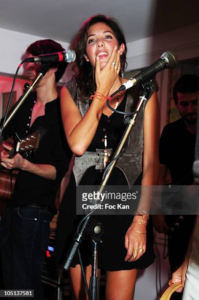 Singer Tamara Kaboutchek and her band perform during the Featherstone & Co 'GreenTs' Exhibition at the Magda Danysz Gallery on September 22, 2010 in...