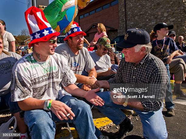 Oct. 09: Republican candidate for U.S. Senate John Raese talks with supporter Mark Mallow, shaking hands, who is an owner operator trucker in the...