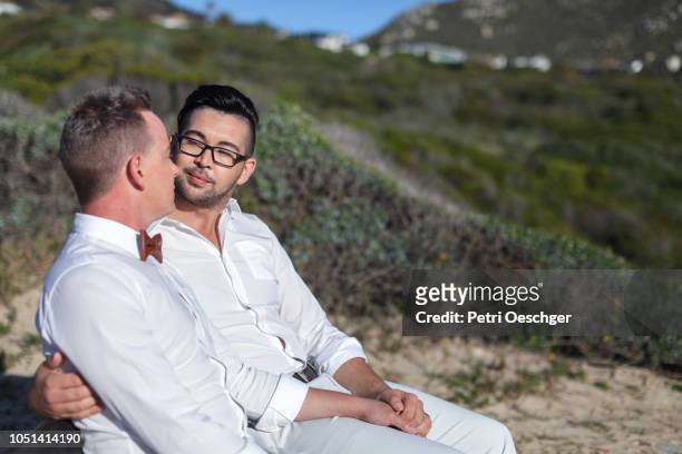 gay wedding by the sea. - llandudno stock pictures, royalty-free photos & images
