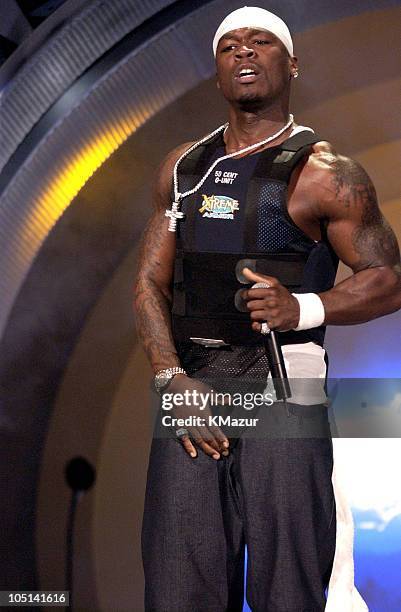 Cent performs at the 2003 MTV Movie Awards in a bullet proof vest