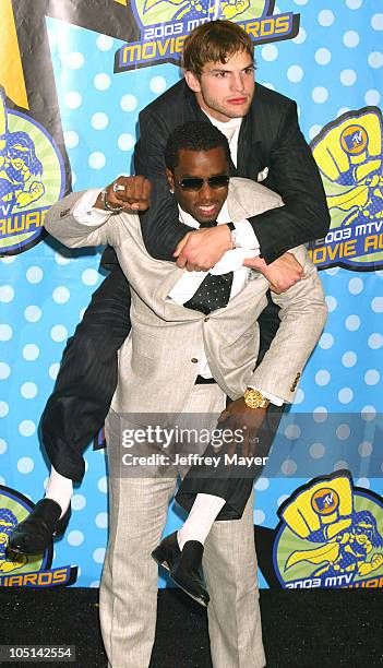Sean "P. Diddy" Combs & Ashton Kutcher during 2003 MTV Movie Awards - Press Room at Shrine Auditorium in Los Angeles, California, United States.
