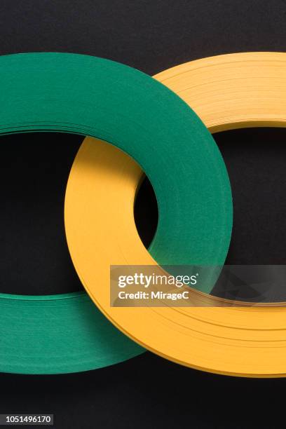 connection of multi-layer paper stripes - cadena objeto fabricado fotografías e imágenes de stock
