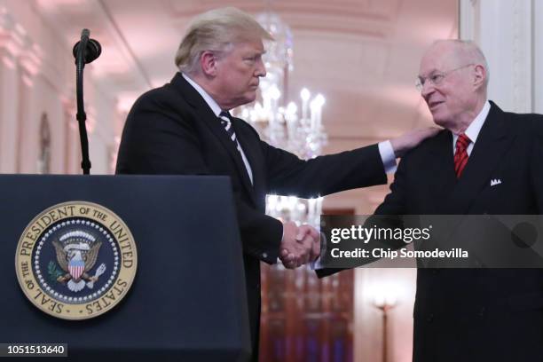 President Donald Trump shakes hands with retired Justice Anthony Kennedy during the ceremonial swearing in of Associate Justice Brett Kavanaugh in...