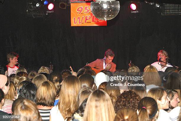 Zac Hanson, Isaac Hanson and Taylor Hanson perform for fans