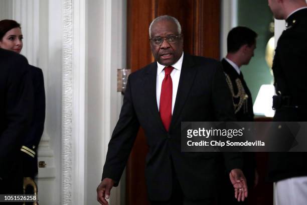 Supreme Court Associate Justice Clarence Thomas arrives for the ceremonial swearing in of Associate Justice Brett Kavanaugh in the East Room of the...