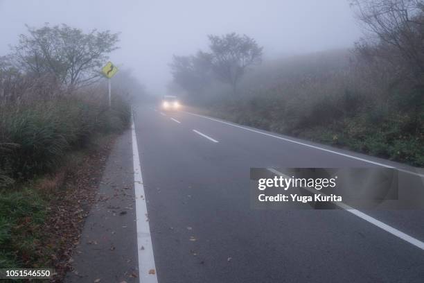 driving in a fog - driving in fog stock pictures, royalty-free photos & images