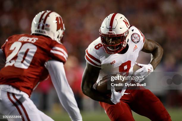 Stanley Morgan Jr. #8 of the Nebraska Cornhuskers runs with the ball while being chased by Faion Hicks of the Wisconsin Badgers in the second quarter...