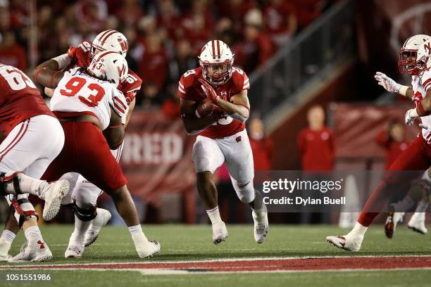 Jonathan Taylor of the Wisconsin Badgers runs with the ball in the third quarter against the Nebraska Cornhuskers at Camp Randall Stadium on October...