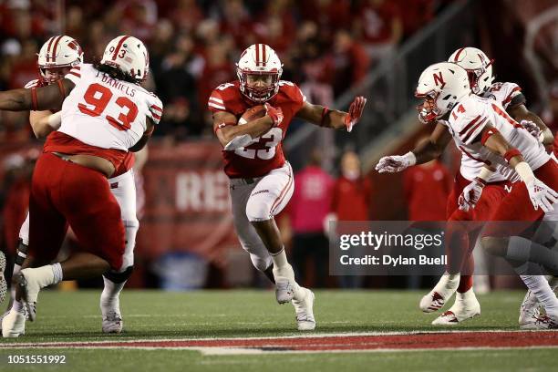 Jonathan Taylor of the Wisconsin Badgers runs with the ball in the third quarter against the Nebraska Cornhuskers at Camp Randall Stadium on October...