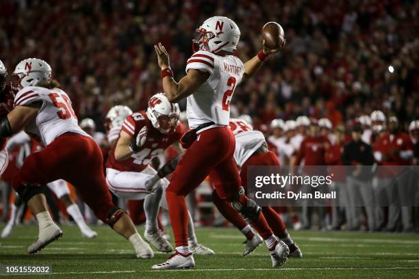 Adrian Martinez of the Nebraska Cornhuskers throws a pass in the third quarter against the Wisconsin Badgers at Camp Randall Stadium on October 6,...