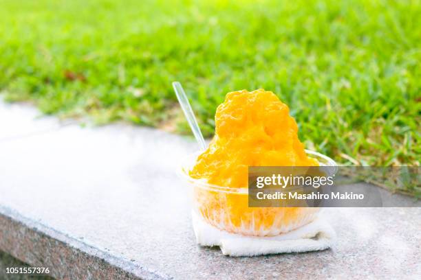 kakigori, japanese shaved ice with  mango puree - mango shaved ice stock pictures, royalty-free photos & images