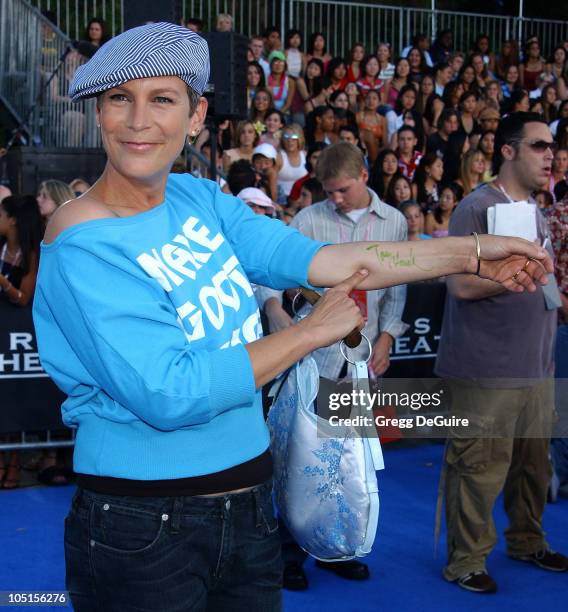 Jamie Lee Curtis pointing to her "Tony Hawk" autograph he signed on her forearm