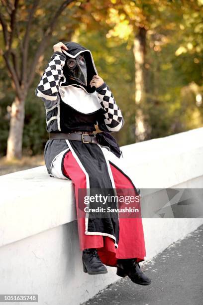 women  dressed in plague doctor mask - beak mask stock pictures, royalty-free photos & images