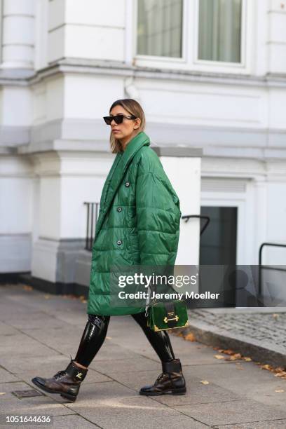 Aylin Koenig wearing a Baum & Pferdgarten jacket, Prada bag, latex pants from topshop, Louis Vuitton boots and a Celine sunglasses on October 08,...