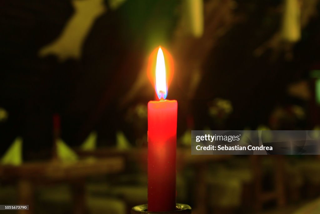 Close up of candle burning in church,Ceremony, Halloween,Romania