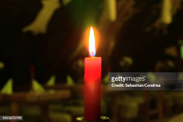 close up of candle burning in church,ceremony, halloween,romania - feierliche veranstaltung stock-fotos und bilder