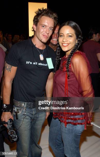 Jamie McCarthy and guest during Mercedes-Benz Fashion Week Spring 2004 - Marc Jacobs - Front Row at New York State Armory in New York City, New York,...