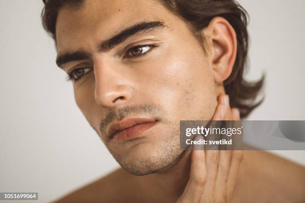 beauty portrait of young man - silky brown hair stock pictures, royalty-free photos & images