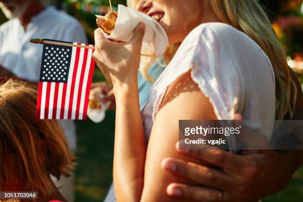 multi-generation family celebrating 4th of july - 8 month pregnant stock pictures, royalty-free photos & images
