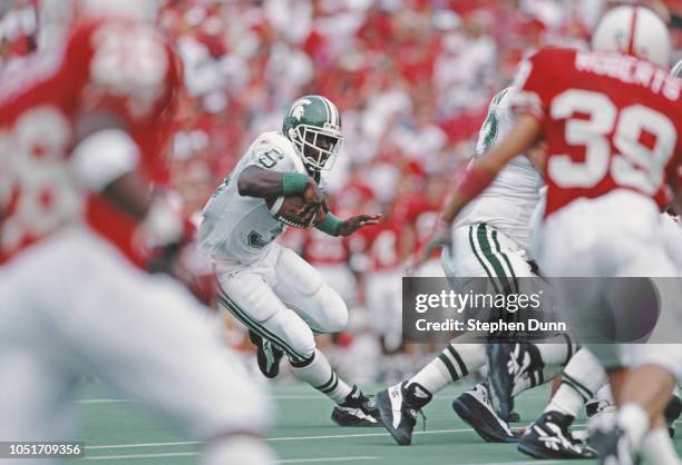 Sedrick Irvin Running Back for Michigan State Spartans runs the ball against the University of Nebraska Cornhuskers during their NCAA Division I-A...