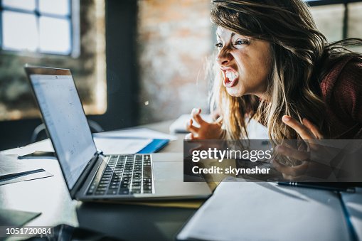 Frustrated woman received a problematic e-mail over computer. Frustrated woman received a problematic e-mail over computer.
