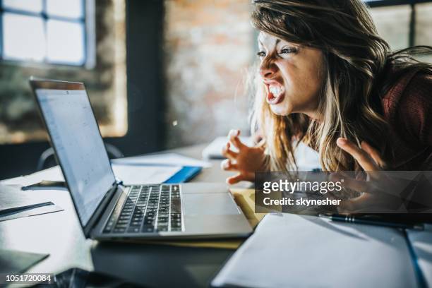 frustrated woman received a problematic e-mail over computer. - problems stock pictures, royalty-free photos & images
